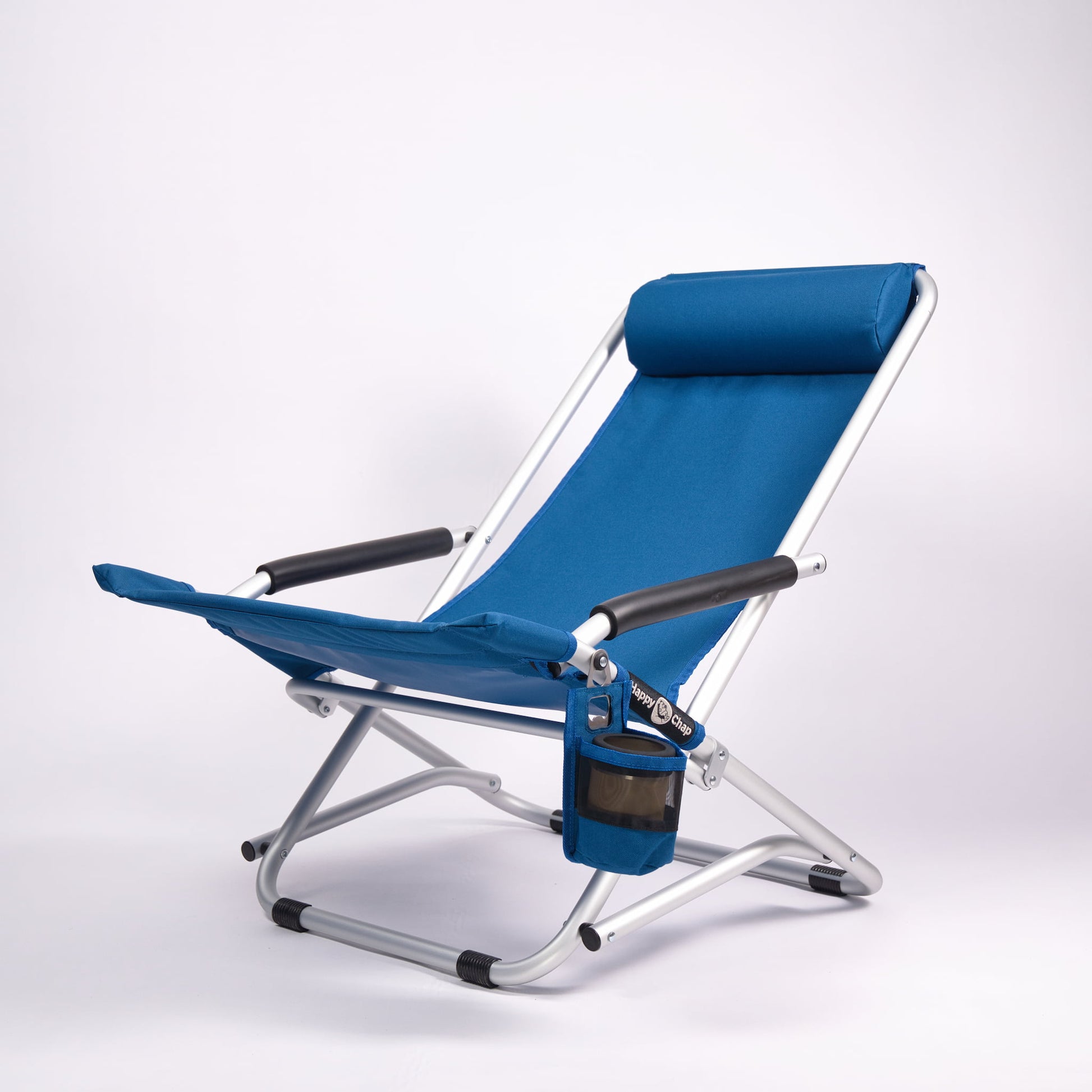 Blue folding beach chair with cup holder on a white background