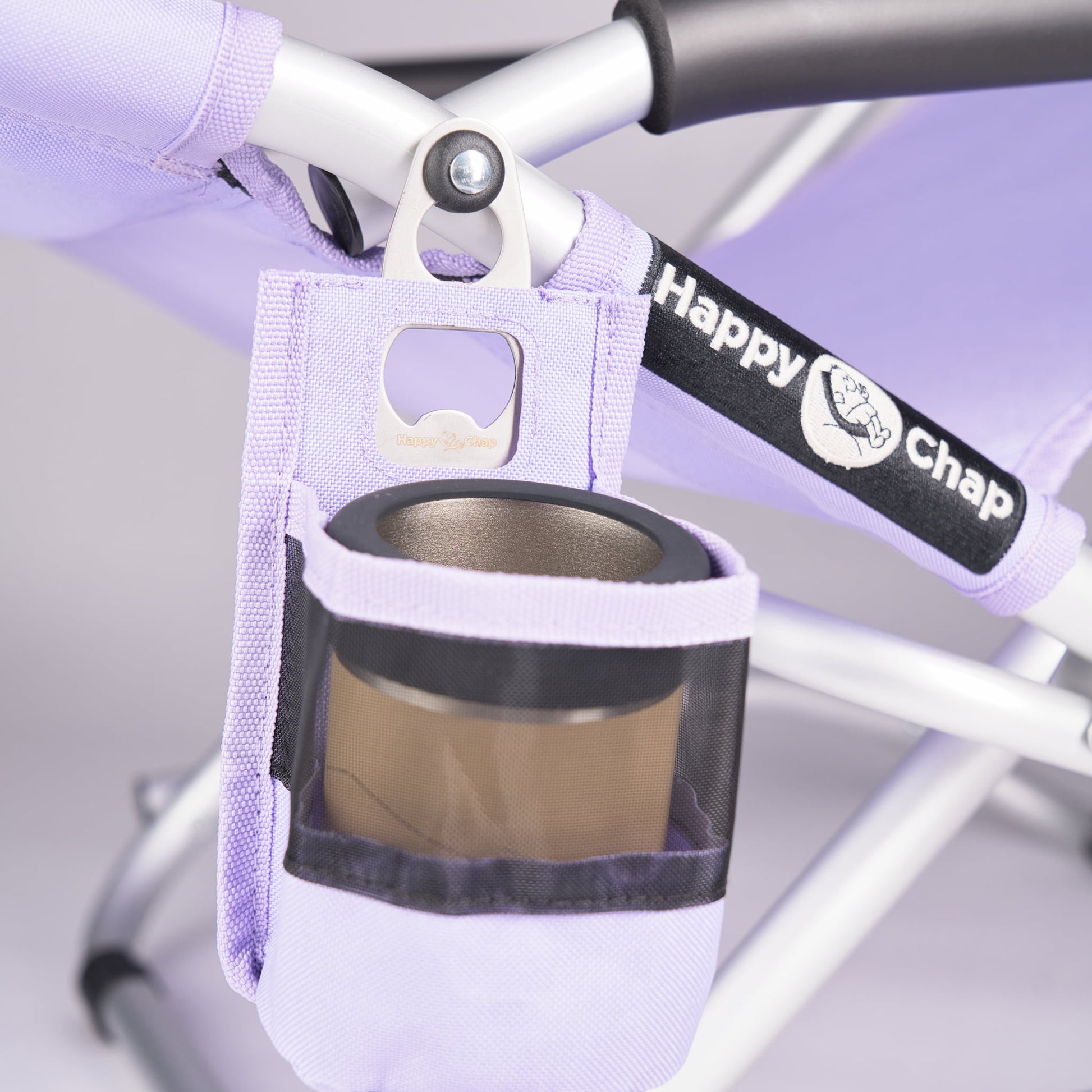 purple cup holder with a bottle opener attached to a happy chap outdoor chair, featuring the brand 'Happy Chap'.