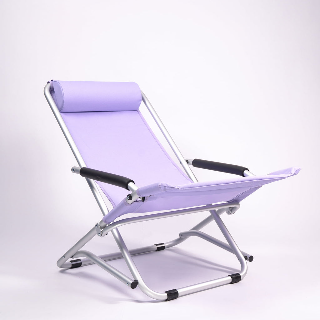 Purple folding camping chair on a white background