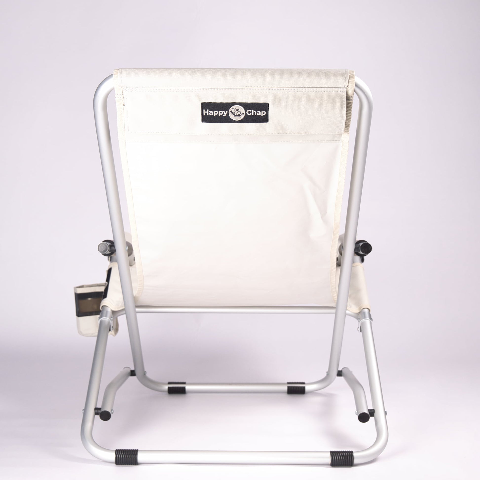 Beige folding chair with aluminium frame on a white background, featuring 'Happy Chap' branding.