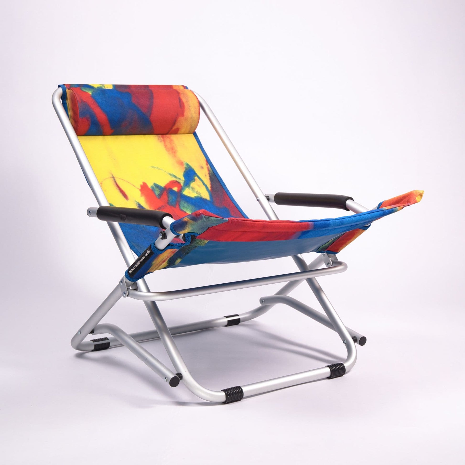 Colorful folding chair with abstract art design on a white background